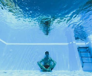 A,Man,Practicing,Apnea,Meditation,Inside,A,Pool